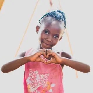 Girl with heart symbol displayed